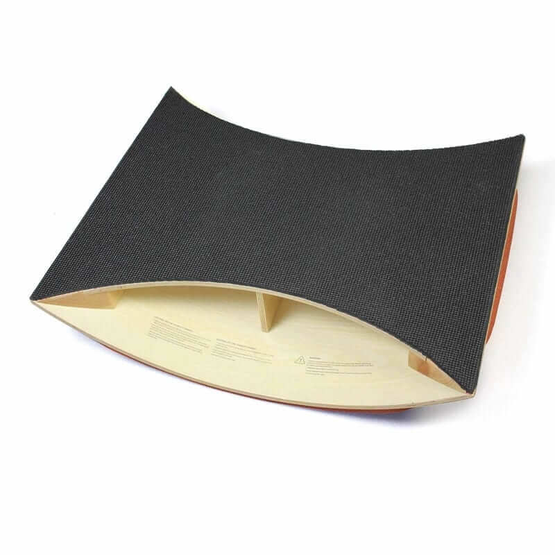 De stability barrel STOTT met de platte kant naar boven voor verschillende evenwichtsoefeningen